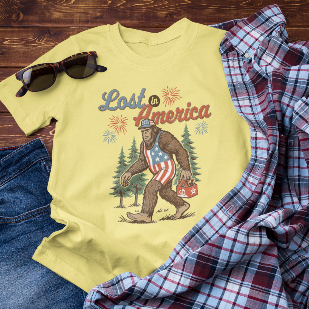 Lost in America Bigfoot Tee, Casual Summer Shirt, Outdoor Adventure Tee, Fun Gift for Nature Lovers, Festival Outfit, Patriotic Apparel - Old Glory 1776 Apparel